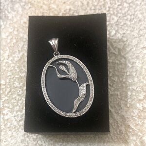White gold and onyx  floral pendant
